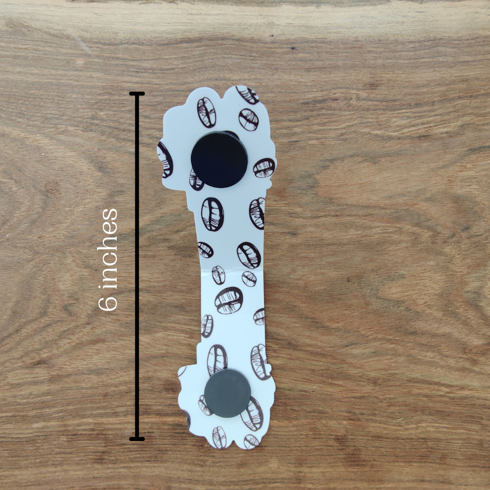 The inside of the iced coffee gnome magnetic bookmark features 2 magnets. The bookmark measures 6 inches tall when open.