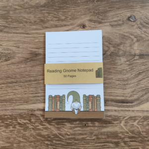 A white notepad with black lines. A gnome wearing a green hat is sitting on a bookshelf at the bottom of the page.