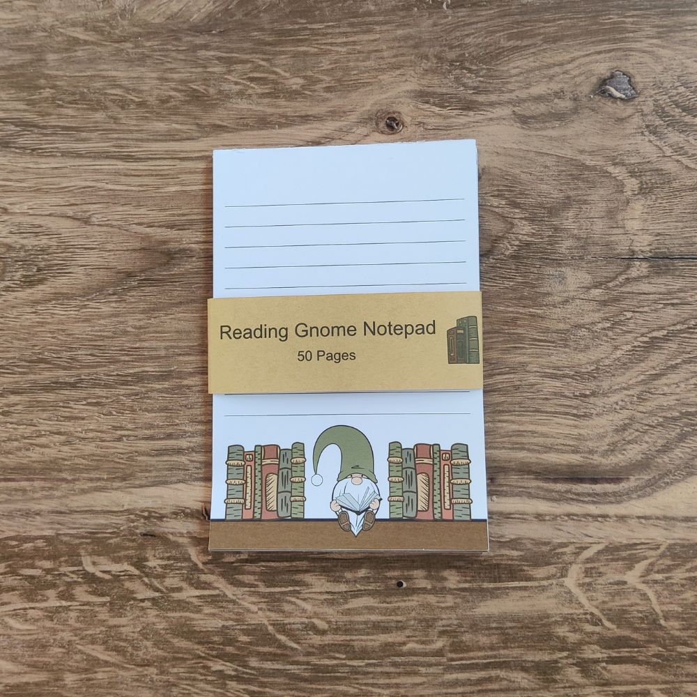 A white notepad with black lines. A gnome wearing a green hat is sitting on a bookshelf at the bottom of the page.