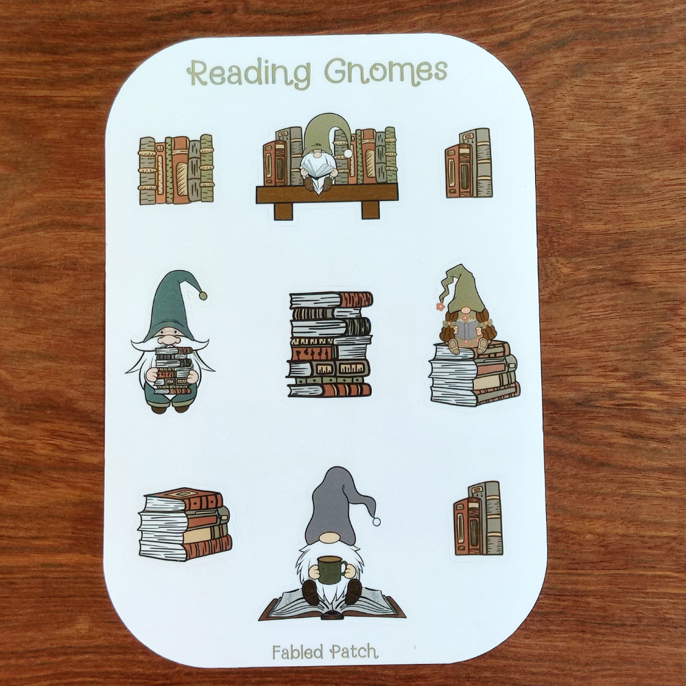 A sticker sheet featuring illustrations of reading gnomes. The gnomes are depicted with books, some holding stacks of books, others reading. The color palette includes greens, browns, and tans.